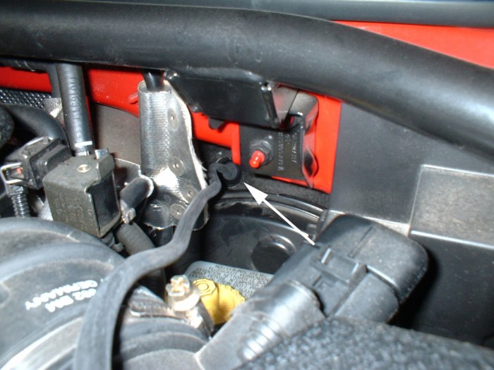 Photo Here is the hose coming out the engine bay, through the grommet